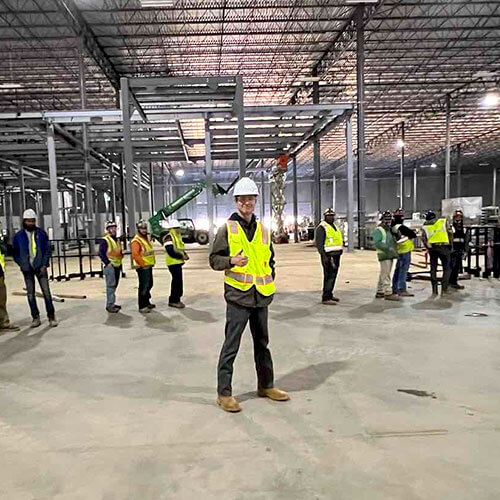 mechanical engineer in parcel facility during conveyor installation