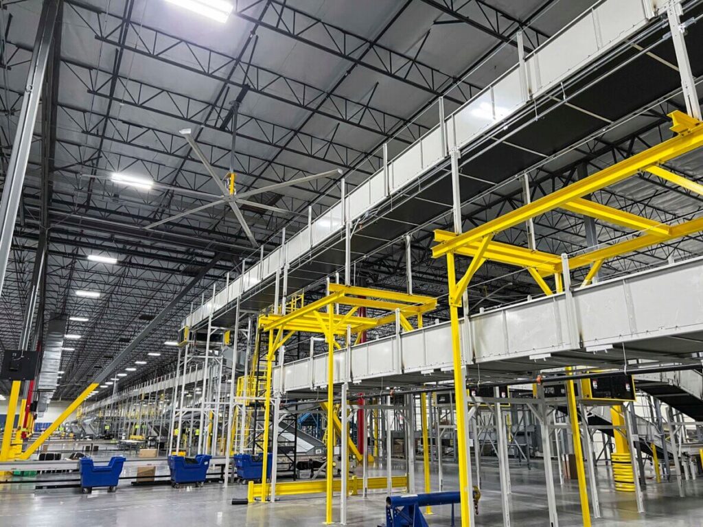elevated conveyor system for parcel handling carrier