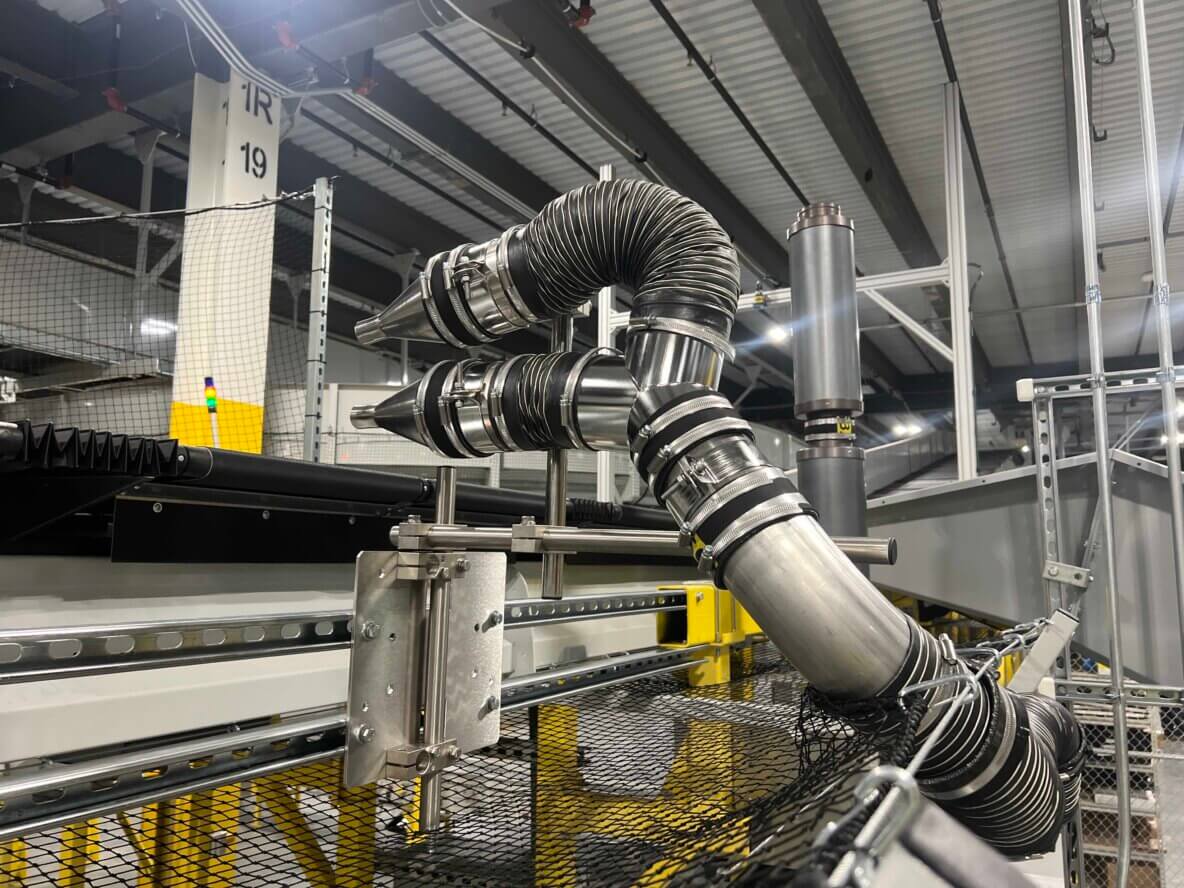 air knife parcel ejection system in automated warehouse