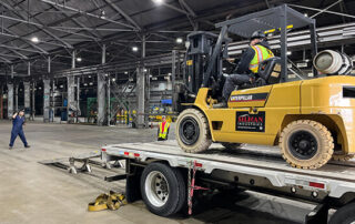 crew unloads equipment at industrial site