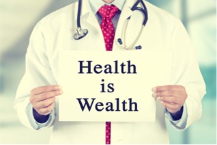 doctor hold a sign which reads "health is wealth"