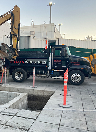 silman industries mack dump truck at oakland international airport