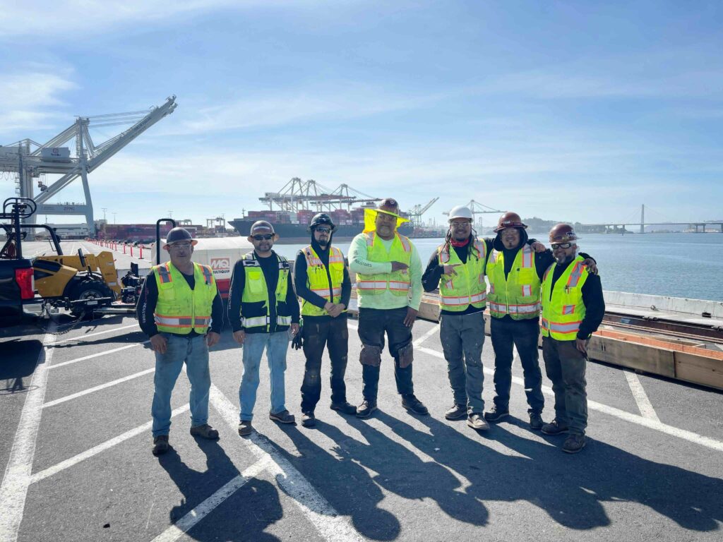 specialty trade team poses during project at the Port of Oakland